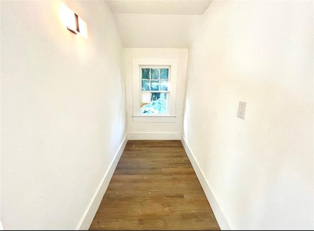 hall with dark hardwood / wood-style flooring