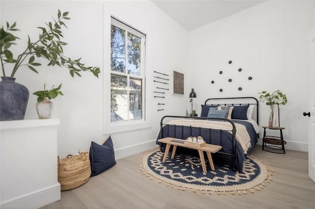 bedroom with hardwood / wood-style floors