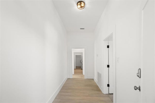 corridor featuring light wood-type flooring