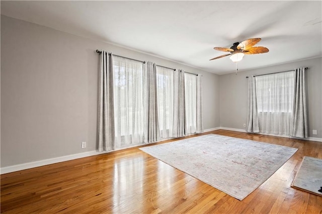 361 Tatum Ave, Mobile, AL 36609 - empty room featuring plenty of natural light, ceiling fan, and wood finished floors