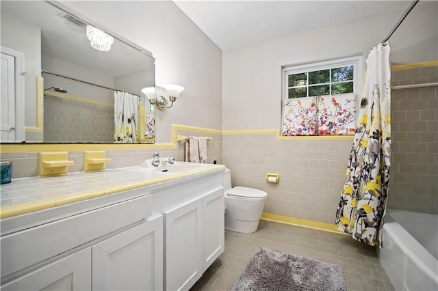 361 Tatum Ave, Mobile, AL 36609 - bathroom with tile walls, tile patterned floors, vanity, shower / bath combination with curtain, and wainscoting