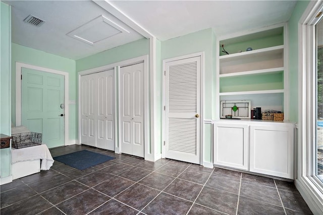 361 Tatum Ave, Mobile, AL 36609 - hall featuring attic access and dark tile patterned floors