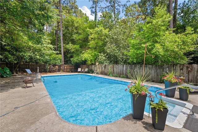 361 Tatum Ave, Mobile, AL 36609 - view of swimming pool featuring a fenced backyard, a patio area, and view of scattered trees