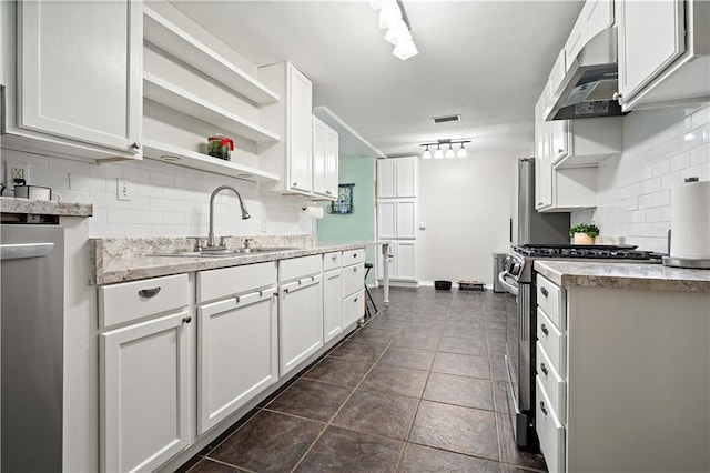 361 Tatum Ave, Mobile, AL 36609 - kitchen featuring gas stove, ventilation hood, tasteful backsplash, open shelves, and white cabinetry