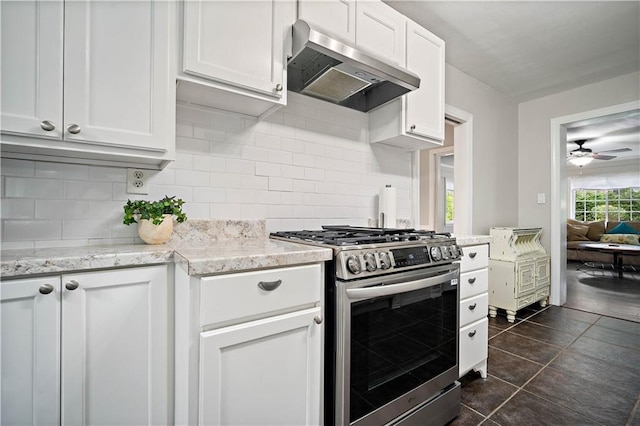 361 Tatum Ave, Mobile, AL 36609 - kitchen with stainless steel range with gas cooktop, under cabinet range hood, ceiling fan, tasteful backsplash, and white cabinetry
