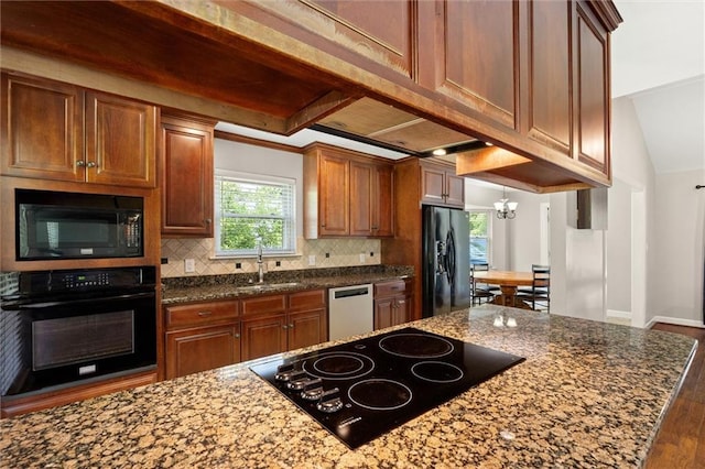 9100 Johnson Rd S, Mobile, AL 36695 - kitchen featuring black appliances, a sink, wood finished floors, a chandelier, and decorative backsplash