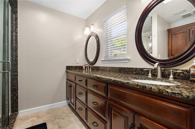 9100 Johnson Rd S, Mobile, AL 36695 - bathroom featuring baseboards, double vanity, and a shower stall
