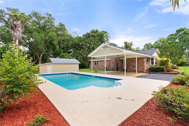 9100 Johnson Rd S, Mobile, AL 36695 - outdoor pool featuring an outbuilding and a patio area