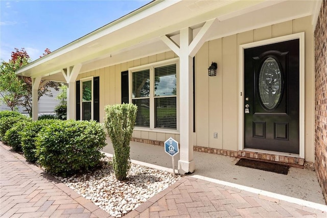 9100 Johnson Rd S, Mobile, AL 36695 - property entrance with a porch and board and batten siding