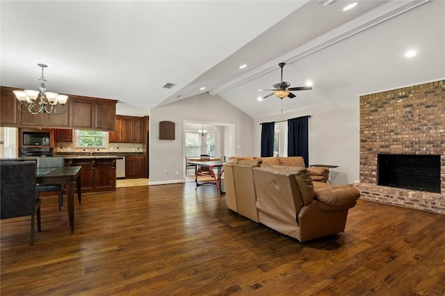 9100 Johnson Rd S, Mobile, AL 36695 - living area with a chandelier, dark wood-style flooring, a ceiling fan, a brick fireplace, and baseboards