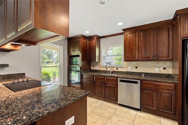 9100 Johnson Rd S, Mobile, AL 36695 - kitchen with black appliances, a sink, backsplash, light tile patterned floors, and recessed lighting