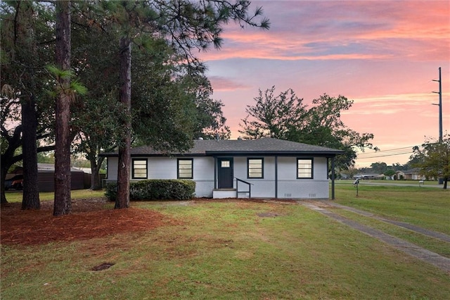 view of front of property with a yard