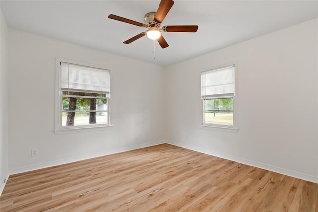 spare room with ceiling fan and light hardwood / wood-style floors