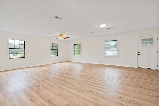 unfurnished room featuring ceiling fan and light hardwood / wood-style floors