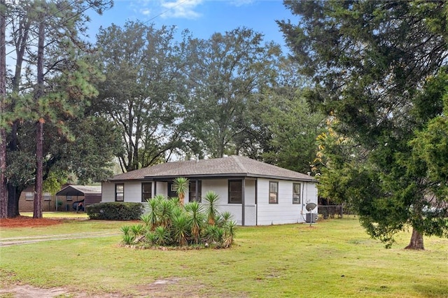 ranch-style house featuring a front lawn