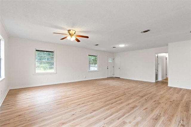 empty room with light hardwood / wood-style flooring and ceiling fan