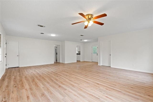 unfurnished living room featuring ceiling fan and light hardwood / wood-style floors