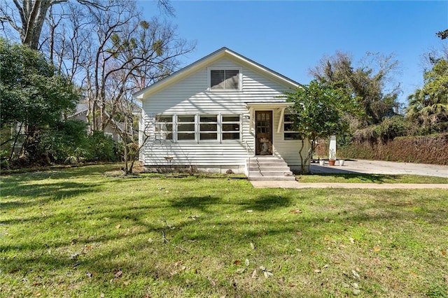 bungalow with a front lawn