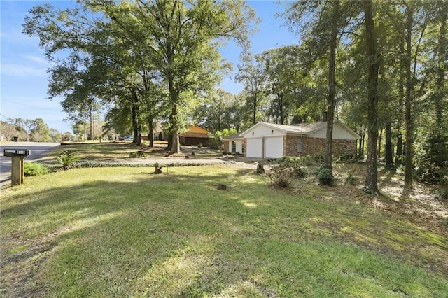 view of yard with a garage