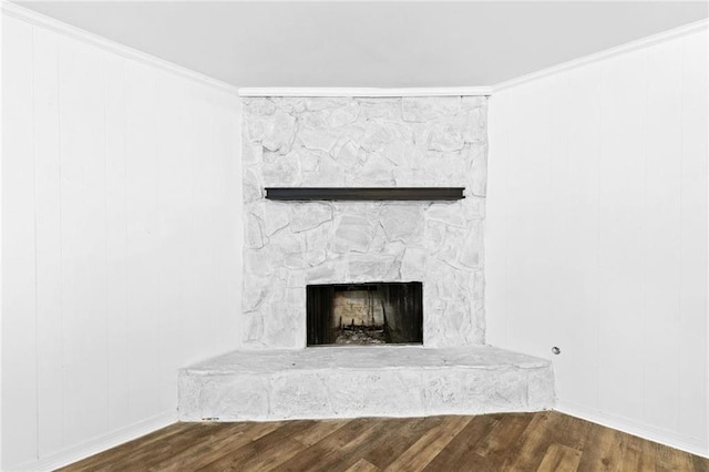 interior details with ornamental molding, a fireplace, and hardwood / wood-style flooring