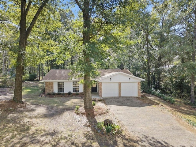 single story home featuring a garage