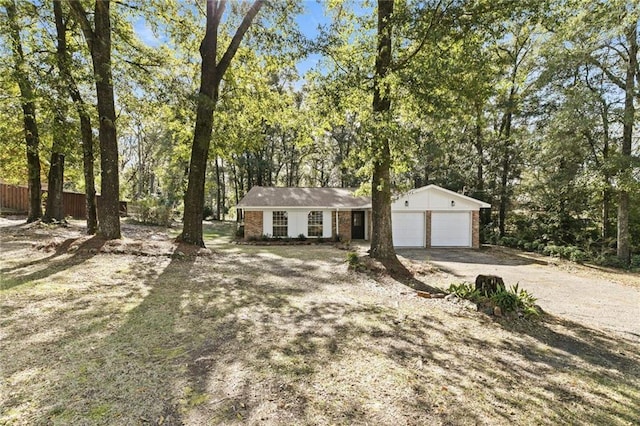 view of front of home featuring a garage and an outdoor structure