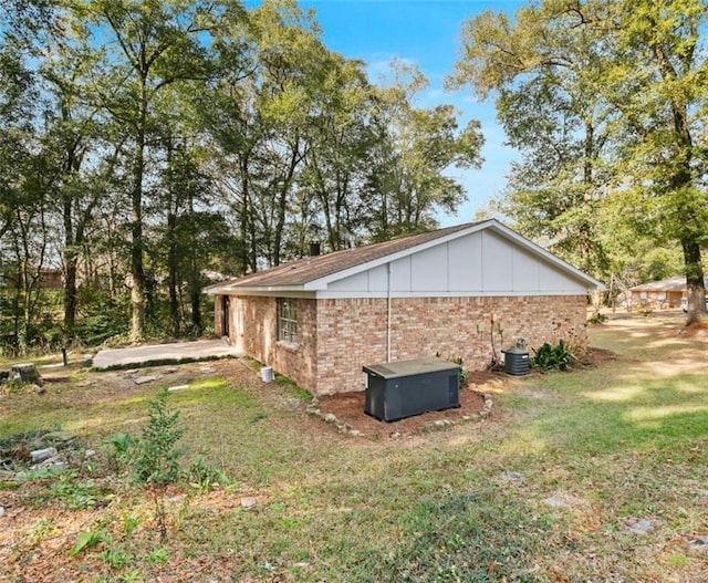 view of property exterior featuring a lawn