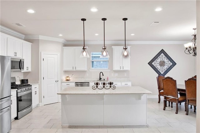 30768 Bauer Ave, Spanish Fort, AL 36527 - kitchen featuring stainless steel appliances, ornamental molding, white cabinets, recessed lighting, and a kitchen island