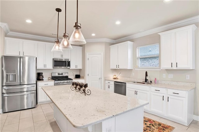 30768 Bauer Ave, Spanish Fort, AL 36527 - kitchen with stainless steel appliances, a kitchen island, white cabinetry, ornamental molding, and light tile patterned flooring