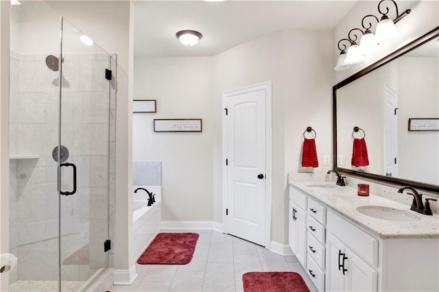 30768 Bauer Ave, Spanish Fort, AL 36527 - full bath with double vanity, a bath, a shower stall, and tile patterned flooring