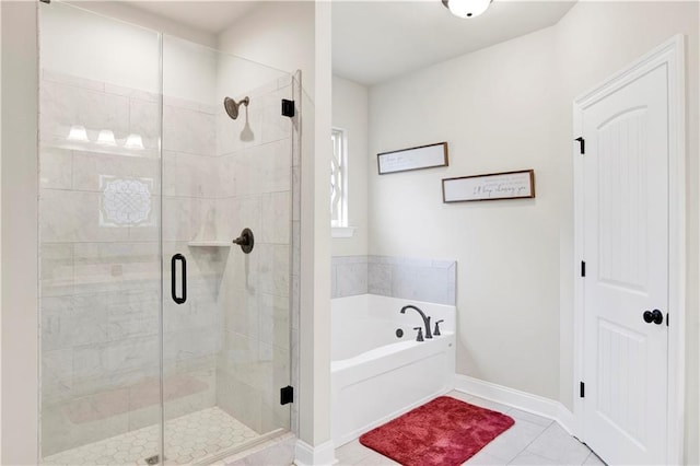 30768 Bauer Ave, Spanish Fort, AL 36527 - full bathroom featuring a garden tub, a stall shower, and tile patterned flooring