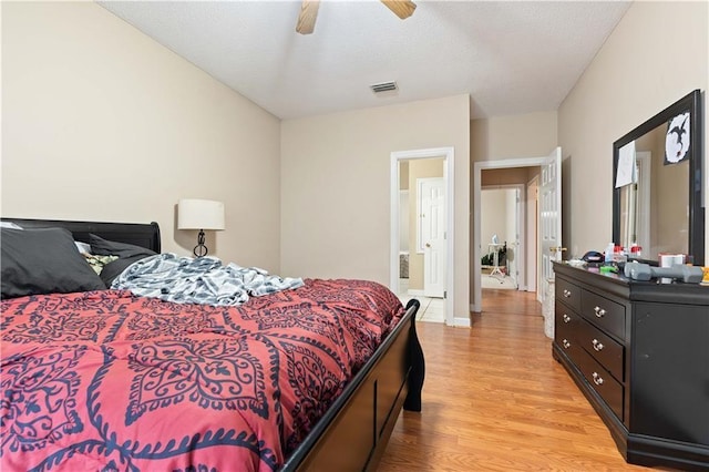 bedroom with light wood-type flooring and ceiling fan