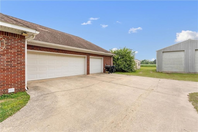 garage with a yard