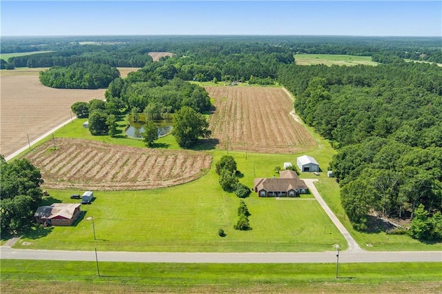 drone / aerial view featuring a water view and a rural view