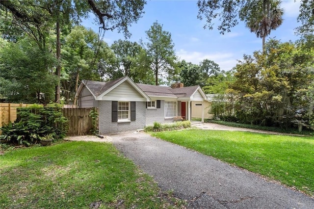 ranch-style home with a front lawn