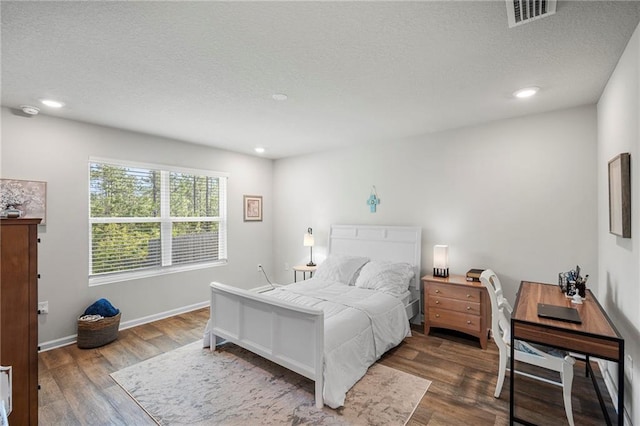 10232 Brodick Loop, Spanish Fort, AL 36527 - bedroom with wood finished floors, a textured ceiling, recessed lighting, and baseboards