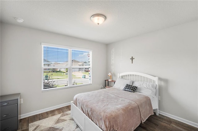 10232 Brodick Loop, Spanish Fort, AL 36527 - bedroom featuring wood finished floors, baseboards, and a textured ceiling
