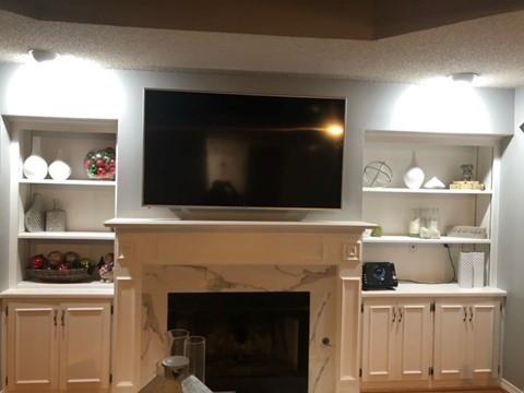 living room with a textured ceiling and a premium fireplace