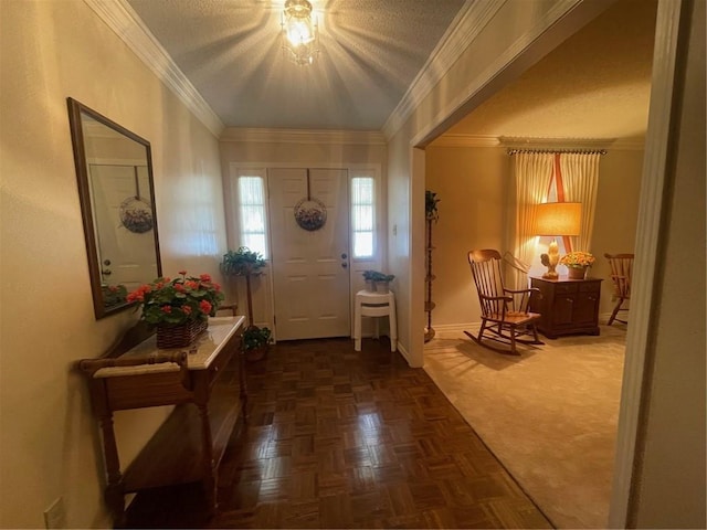 entryway featuring crown molding and baseboards