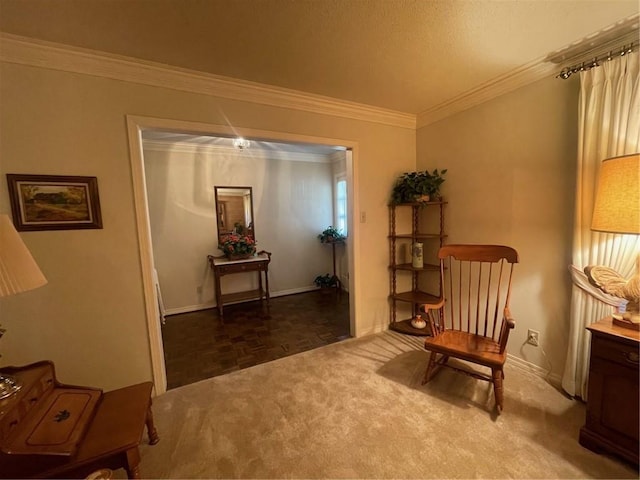 living area with baseboards and crown molding