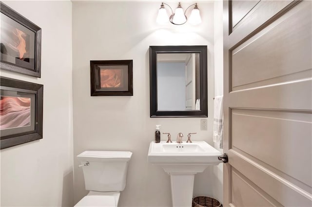 bathroom featuring sink and toilet