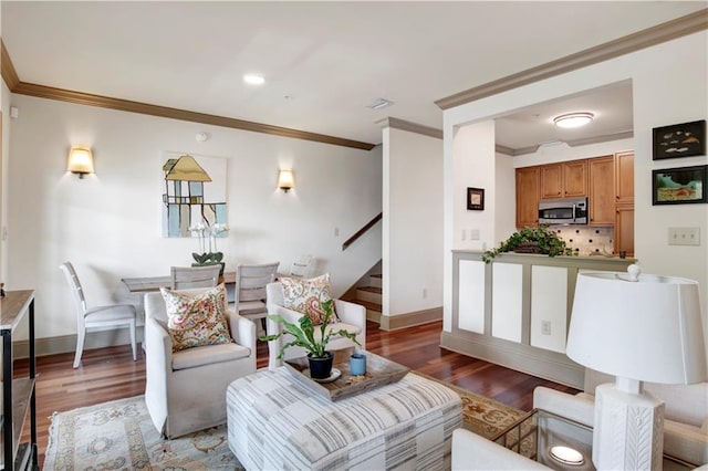 living room with crown molding and hardwood / wood-style floors