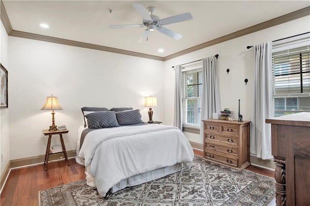 bedroom with ornamental molding, multiple windows, ceiling fan, and dark hardwood / wood-style floors