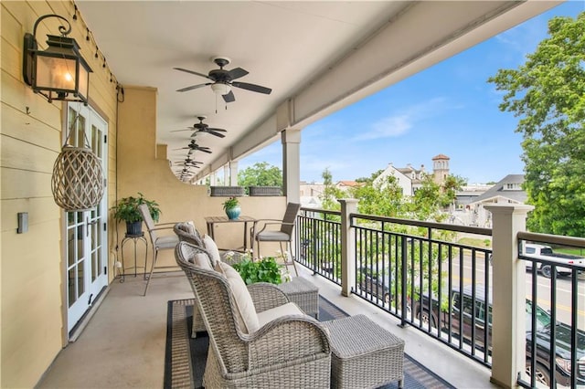 balcony with french doors and ceiling fan