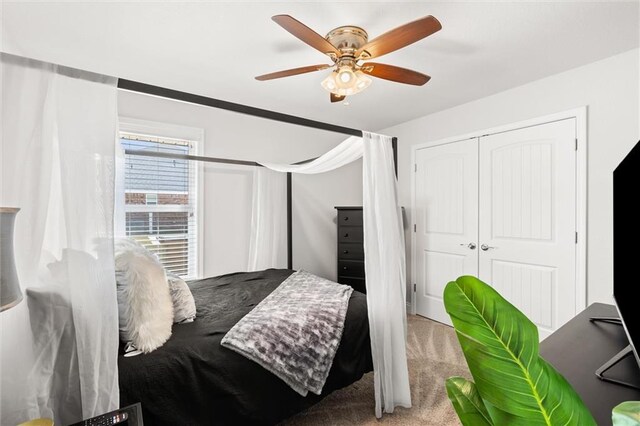 bedroom with a closet, carpet floors, and ceiling fan