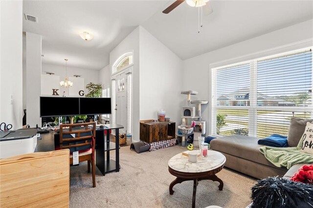 carpeted living room featuring lofted ceiling, ceiling fan with notable chandelier, and visible vents