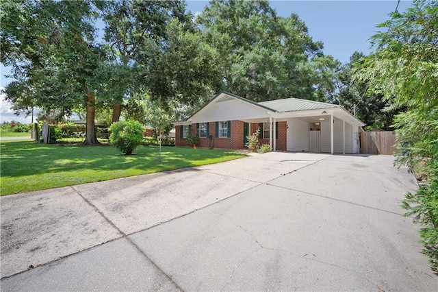 7072 Forest Glenn Ct, Irvington, AL 36544 - ranch-style home with driveway, a carport, and brick siding