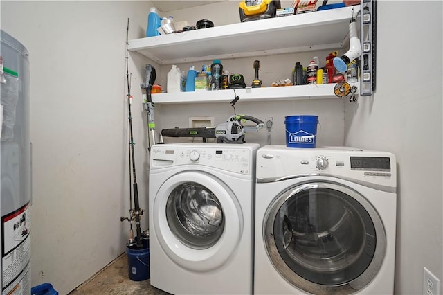 7072 Forest Glenn Ct, Irvington, AL 36544 - laundry area with washing machine and clothes dryer and gas water heater
