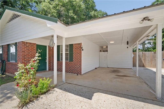 7072 Forest Glenn Ct, Irvington, AL 36544 - view of front of house with brick siding, a carport, and driveway