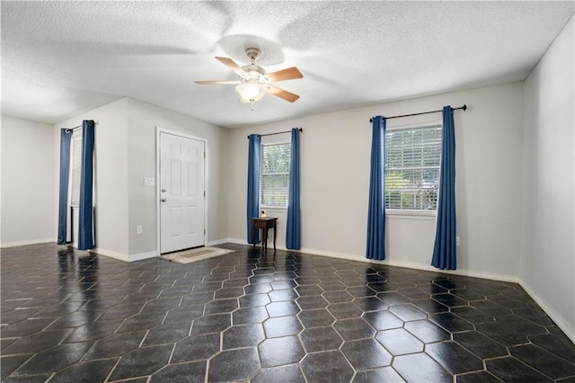 7072 Forest Glenn Ct, Irvington, AL 36544 - unfurnished room featuring a ceiling fan and a textured ceiling